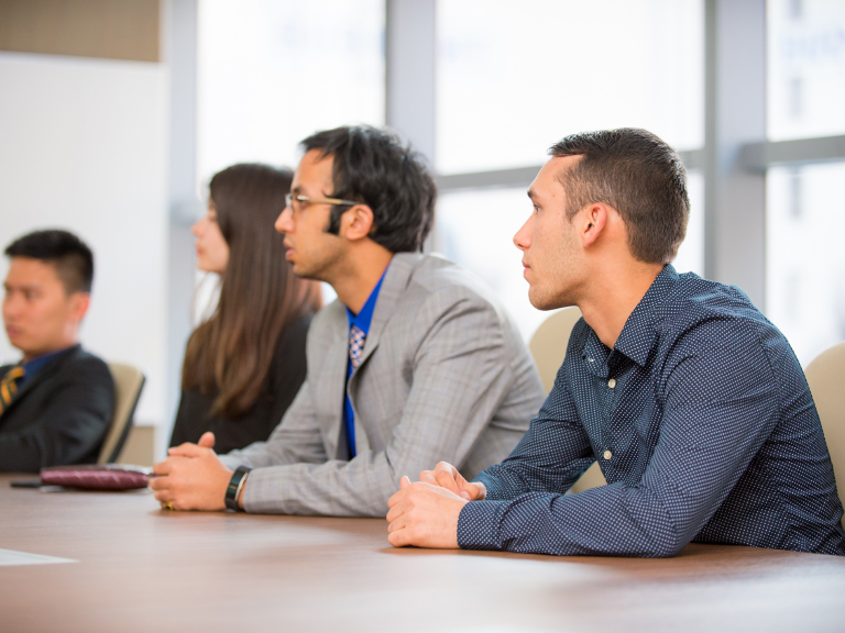 Students involved in a conference and competition