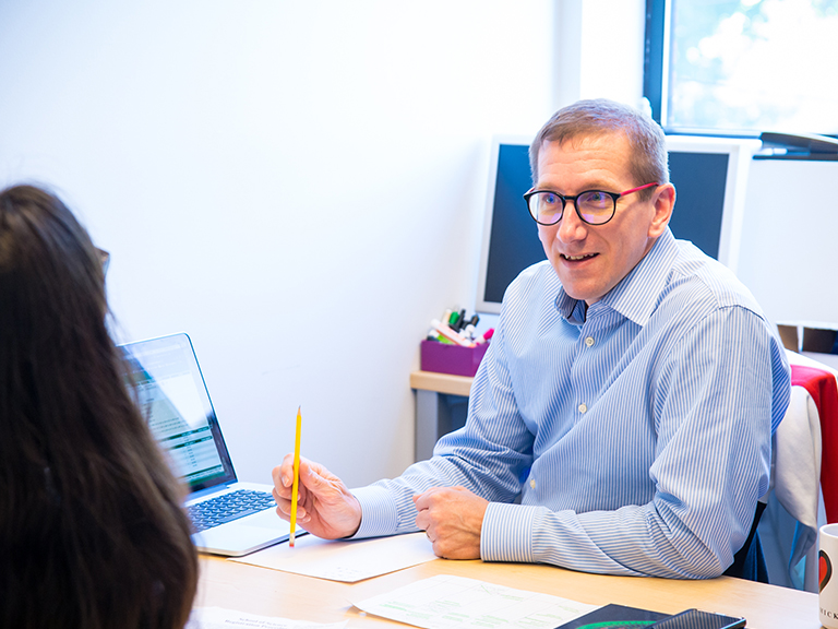 Professor talking to student