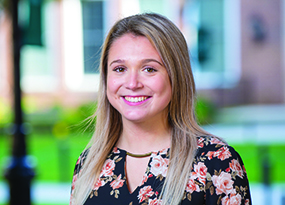 woman with blonde hair smiling at camera